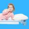 girl lying on a stackable cot