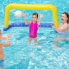 mom with a boy and girl playing in a pool with a volleyball set