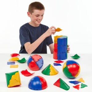 boy playing with polydron sphera class set