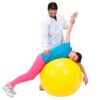 physiotherapist is treating a girl lying on a yellow ball