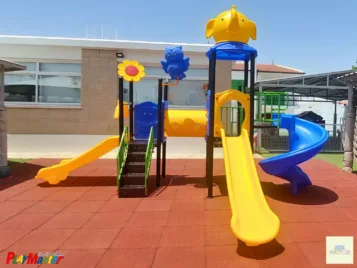 outdoor playground with three slides and a tunel