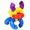 An assembled dog-like creation with colorful curved plastic building blocks in red, blue, yellow, red, and purple colors