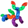 An assembled dog-like creation with colorful curved plastic building blocks in red, blue, yellow, green, orange and purple colors