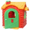 Plastic log-style playhouse with a yellow roof, slightly open green arched door, green shutters, and red details designed for children’s imaginative play