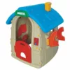 Plastic playhouse for kids featuring a bright blue roof with chimney, beige walls, a red door, and round red windows for imaginative play (side view)