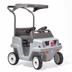 A gray Step2 Side-by-Side Push Around SUV, a two-seater push car for toddlers, with a gray canopy, two steering wheels, and a push handle.