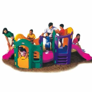 Colorful plastic playground with children climbing, sliding, and playing on interconnected indoor and outdoor play structures.