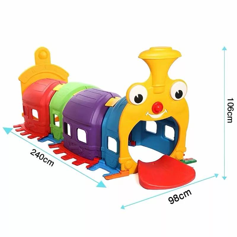 Colorful plastic train-themed playground with a yellow locomotive, connected red, blue, and green play cars, and a front entrance.